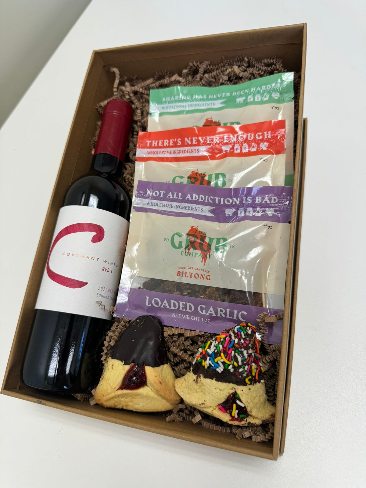A shalach manos basket built around biltong and red wine