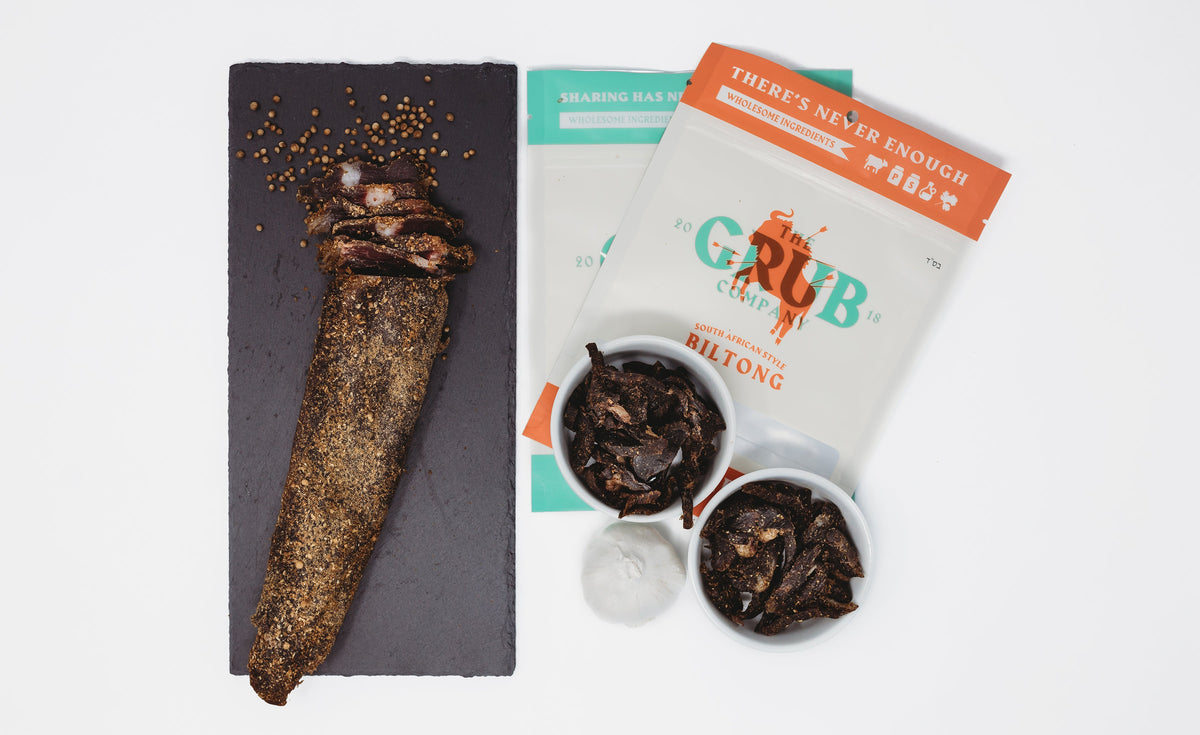 A biltong slab standing on a wooden board
