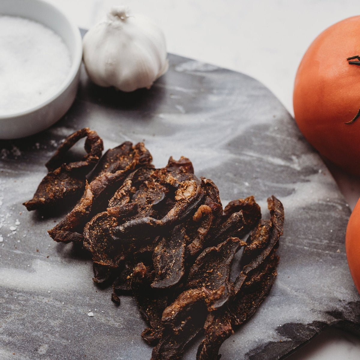 Biltong alongside fresh garlic and chilli