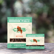 Biltong pouches on a wooden surface outdoors